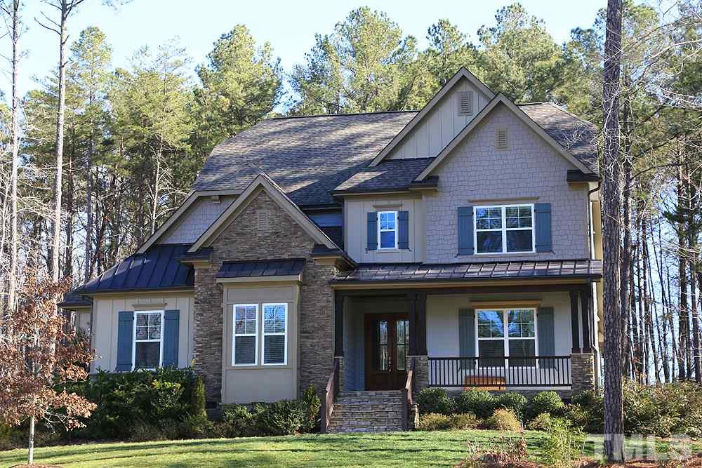 7600 Scarlet Court Raleigh, NC 27614 - Photo 2 of 30 Partial stone front with fiber cement siding.