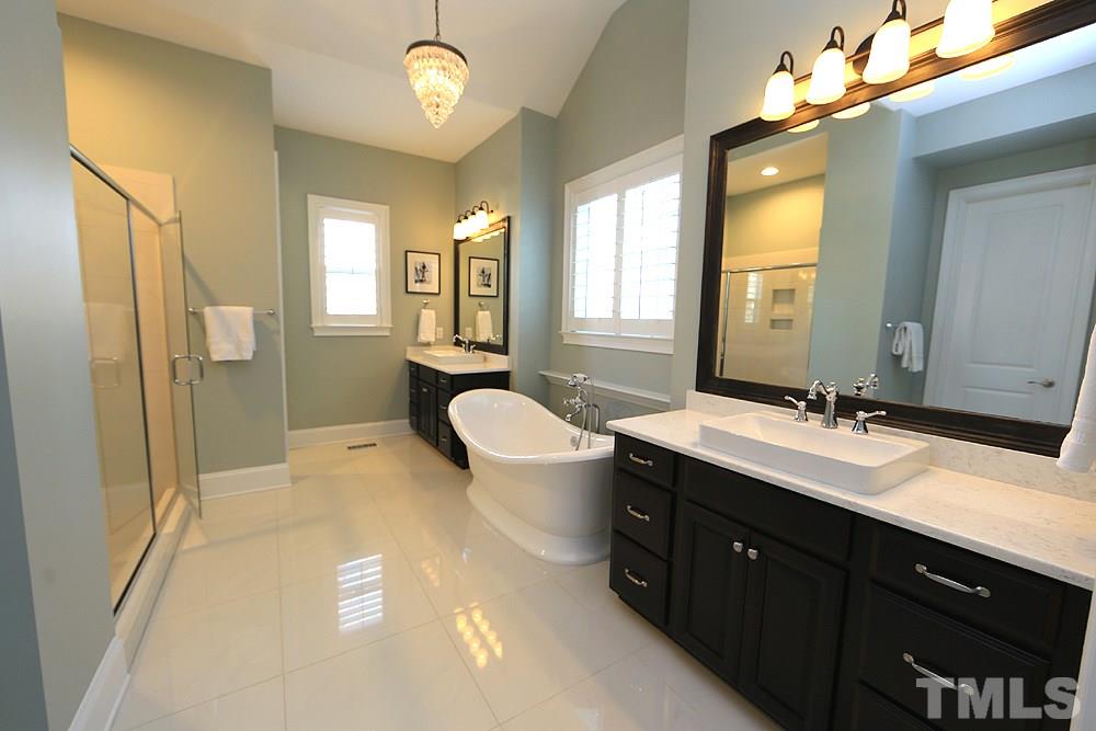 7600 Scarlet Court Raleigh, NC 27614 - Photo 17 of 30 Freestanding tub and spa like bathroom make this space very inviting after a long day at work.