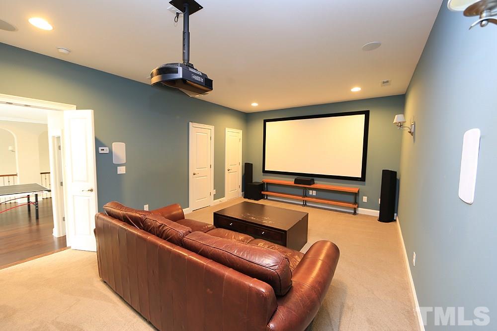 7600 Scarlet Court Raleigh, NC 27614 - Photo 24 of 30 Watch great movies with the family in this very spacious movie room with a 120 inch projector screen.
