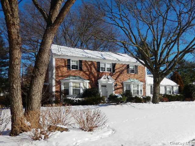 3 Blakelock Road Manhasset, NY 11030 - Photo 1 of 1 a front view of a house with a yard covered in snow