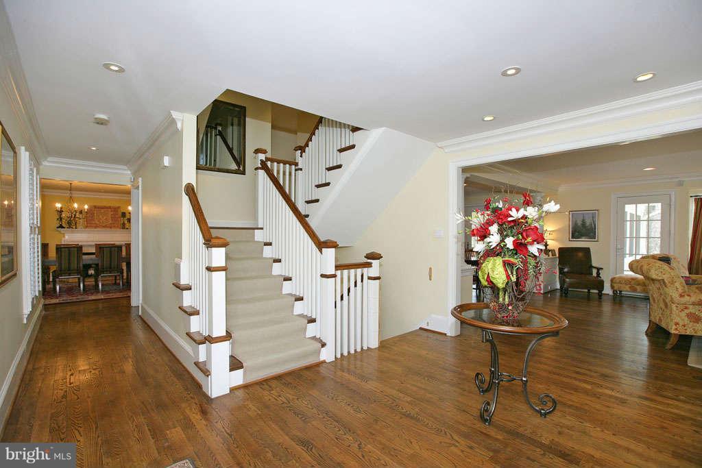 10820 Lockland Road Potomac, MD 20854 - Photo 6 of 30 a living room with furniture and a chandelier
