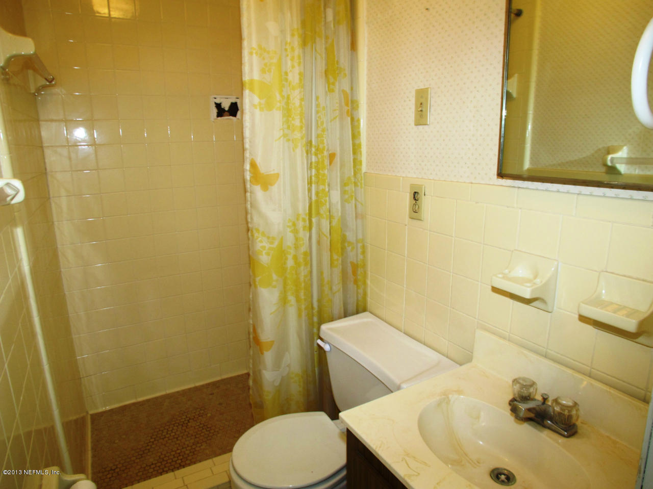 5109 Birkenhead Road Jacksonville, FL 32210 - Photo 11 of 20 a bathroom with a sink toilet and shower