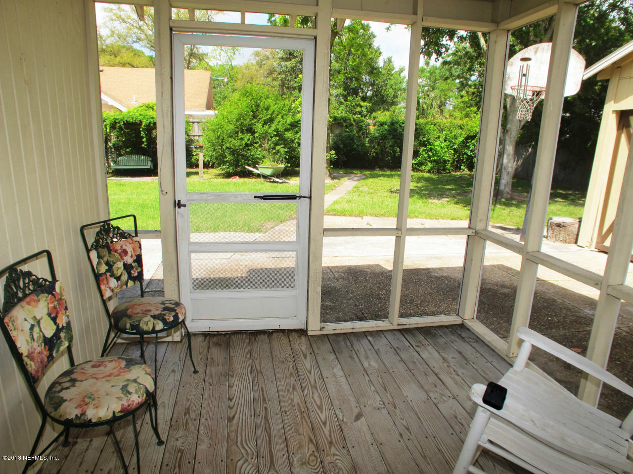 5109 Birkenhead Road Jacksonville, FL 32210 - Photo 15 of 20 a living room with hardwood floor and large windows