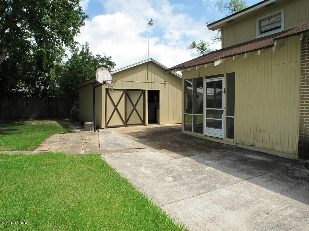 5109 Birkenhead Road Jacksonville, FL 32210 - Photo 19 of 20 a front view of a house with garden