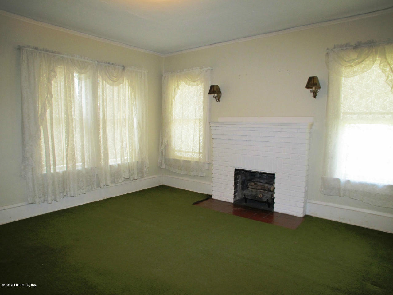 5109 Birkenhead Road Jacksonville, FL 32210 - Photo 4 of 20 a view of a livingroom with a fireplace and window