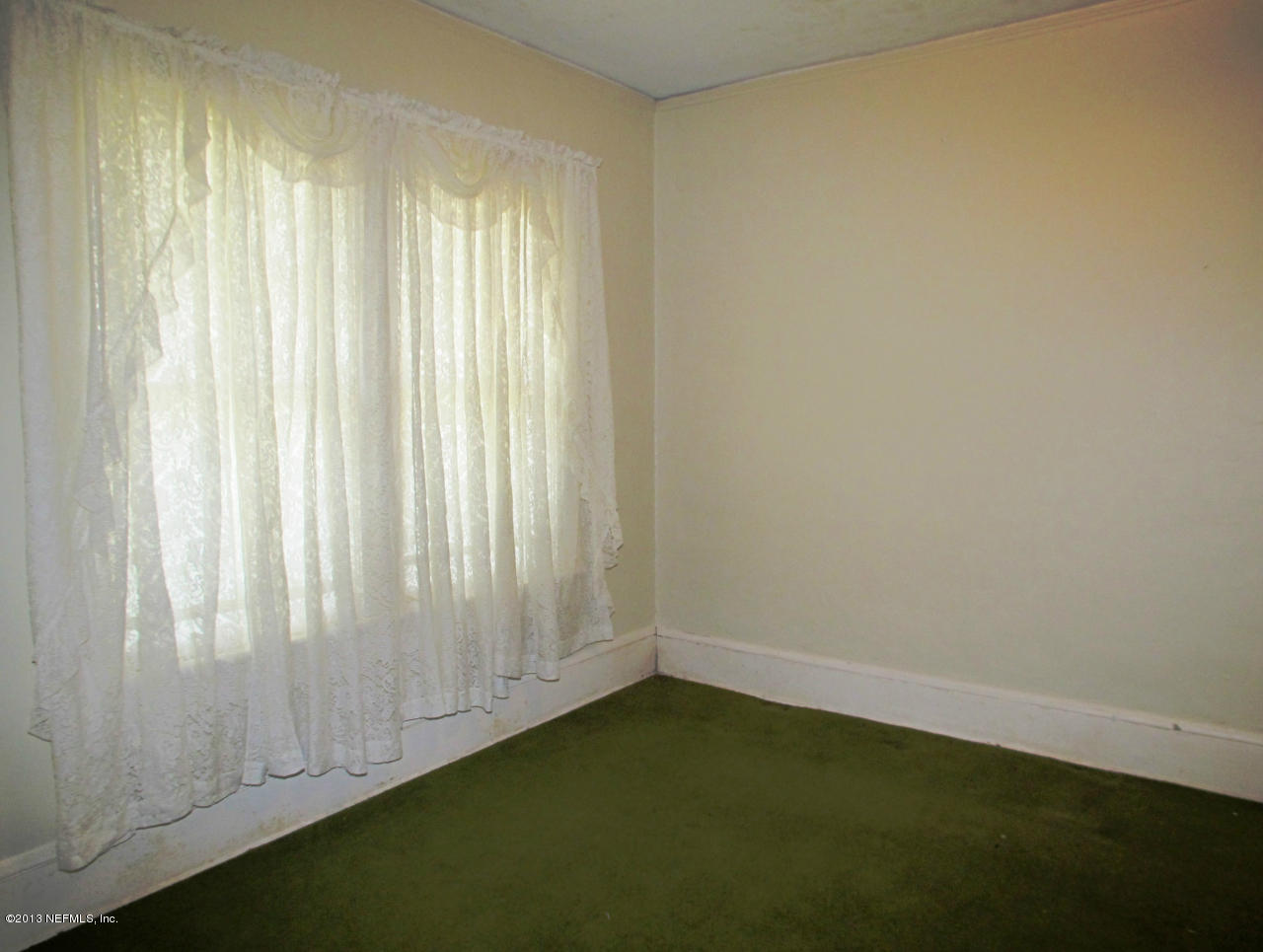 5109 Birkenhead Road Jacksonville, FL 32210 - Photo 6 of 20 a view of an empty room and window
