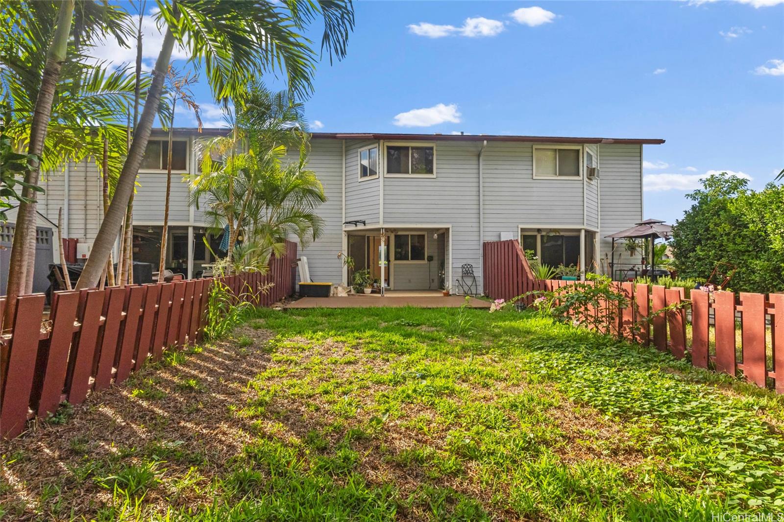 92-1226 Makakilo Drive, Unit 6 Kapolei, HI 96707 - Photo 1 of 15 a front view of house with yard