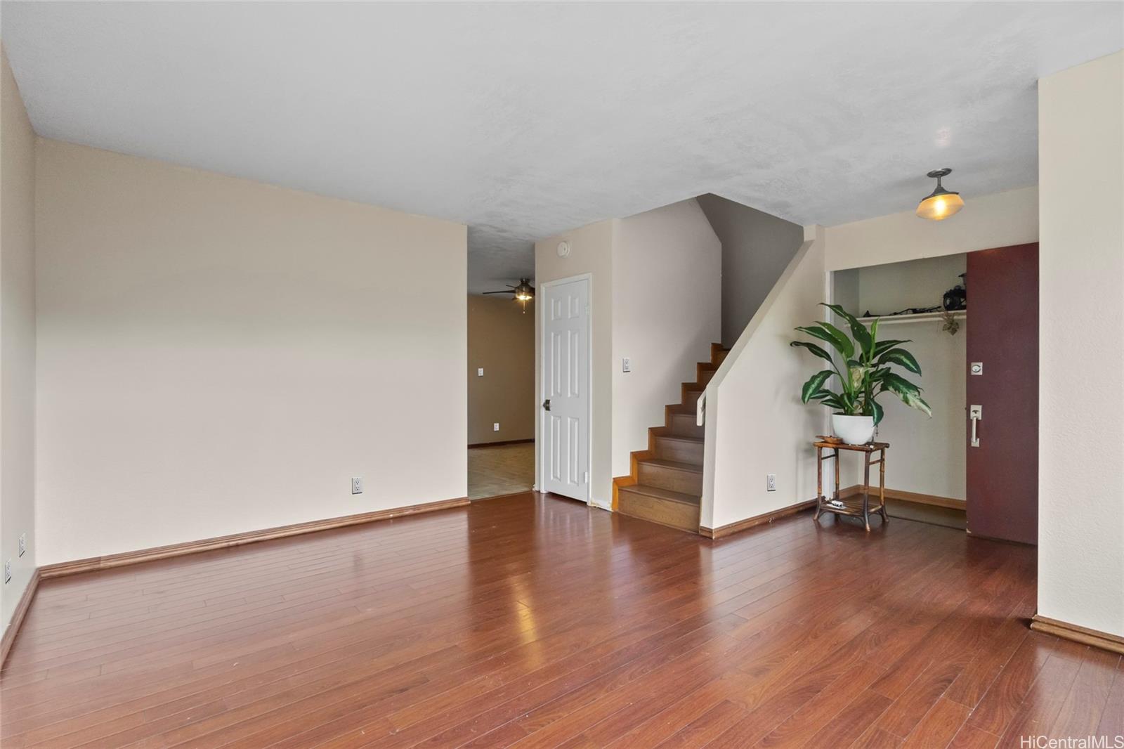 92-1226 Makakilo Drive, Unit 6 Kapolei, HI 96707 - Photo 8 of 15 a view of an empty room with wooden floor