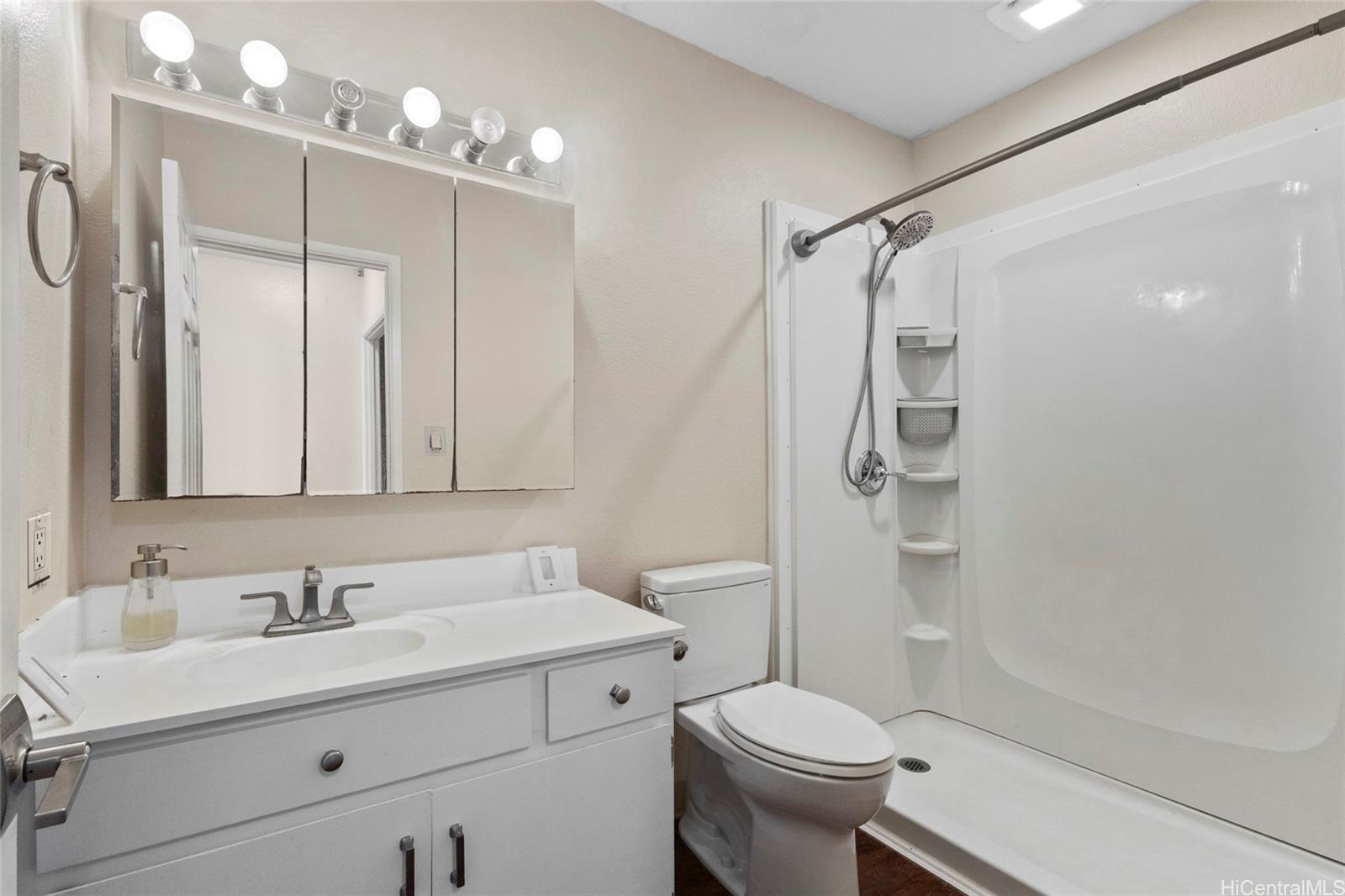 92-1226 Makakilo Drive, Unit 6 Kapolei, HI 96707 - Photo 10 of 15 a bathroom with a sink a toilet and shower