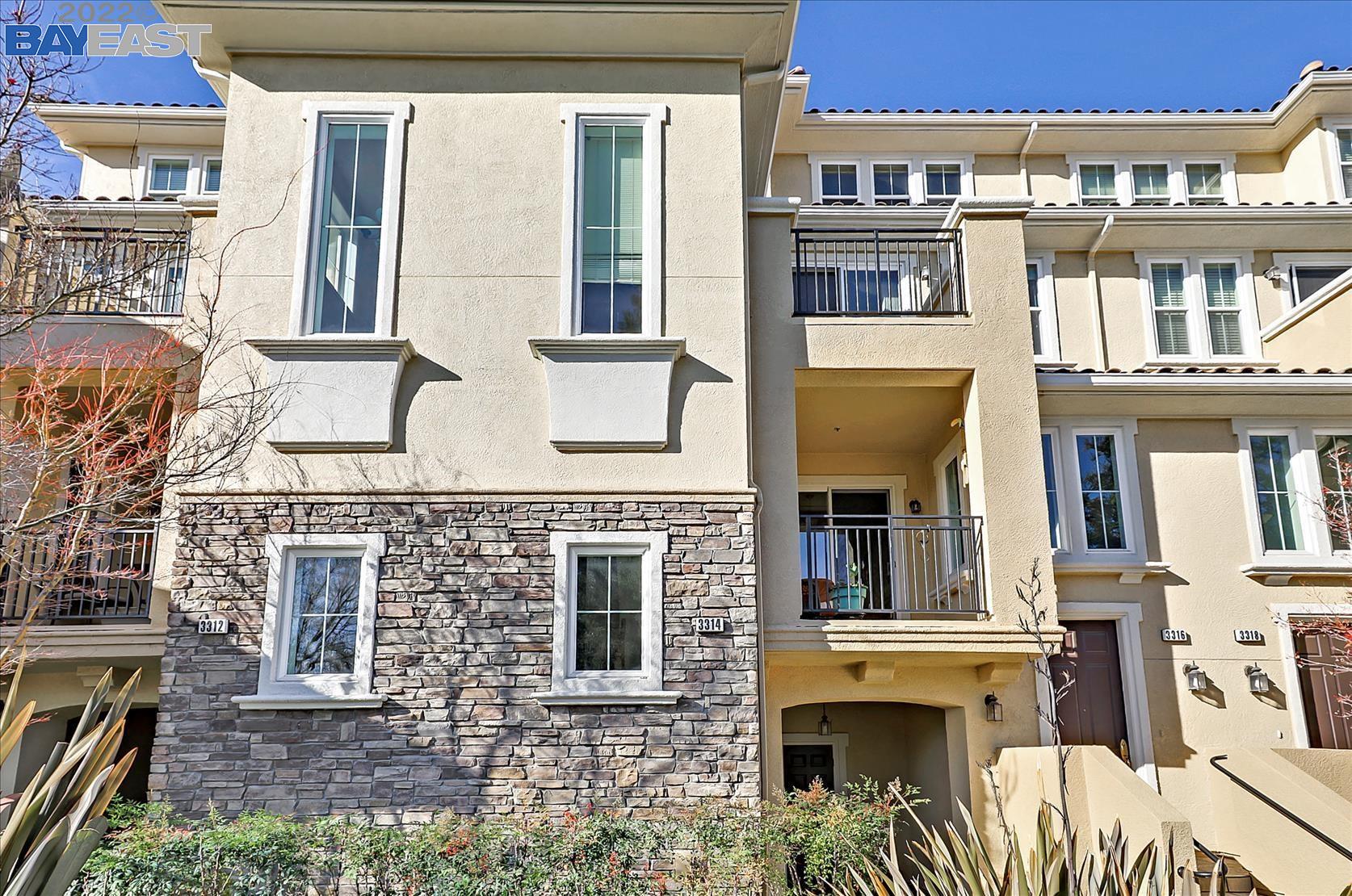 3314 Monaghan Street Dublin, CA 94568 - Photo 1 of 1 a front view of a residential apartment building with a yard