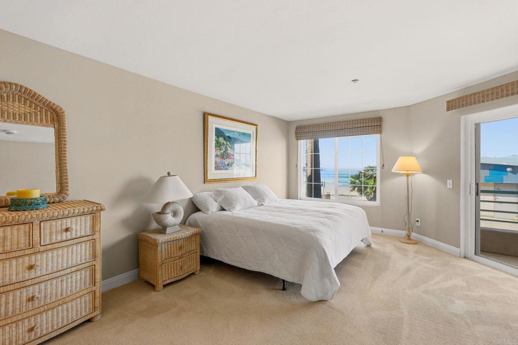 400 The Strand North, Unit 7 Oceanside, CA 92054 - Photo 15 of 35 a spacious bedroom with a bed and a window