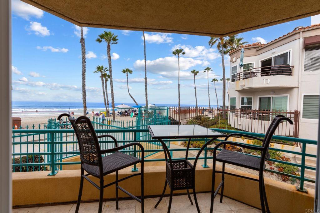 400 The Strand North, Unit 7 Oceanside, CA 92054 - Photo 9 of 35 a view of a chairs and table in the patio