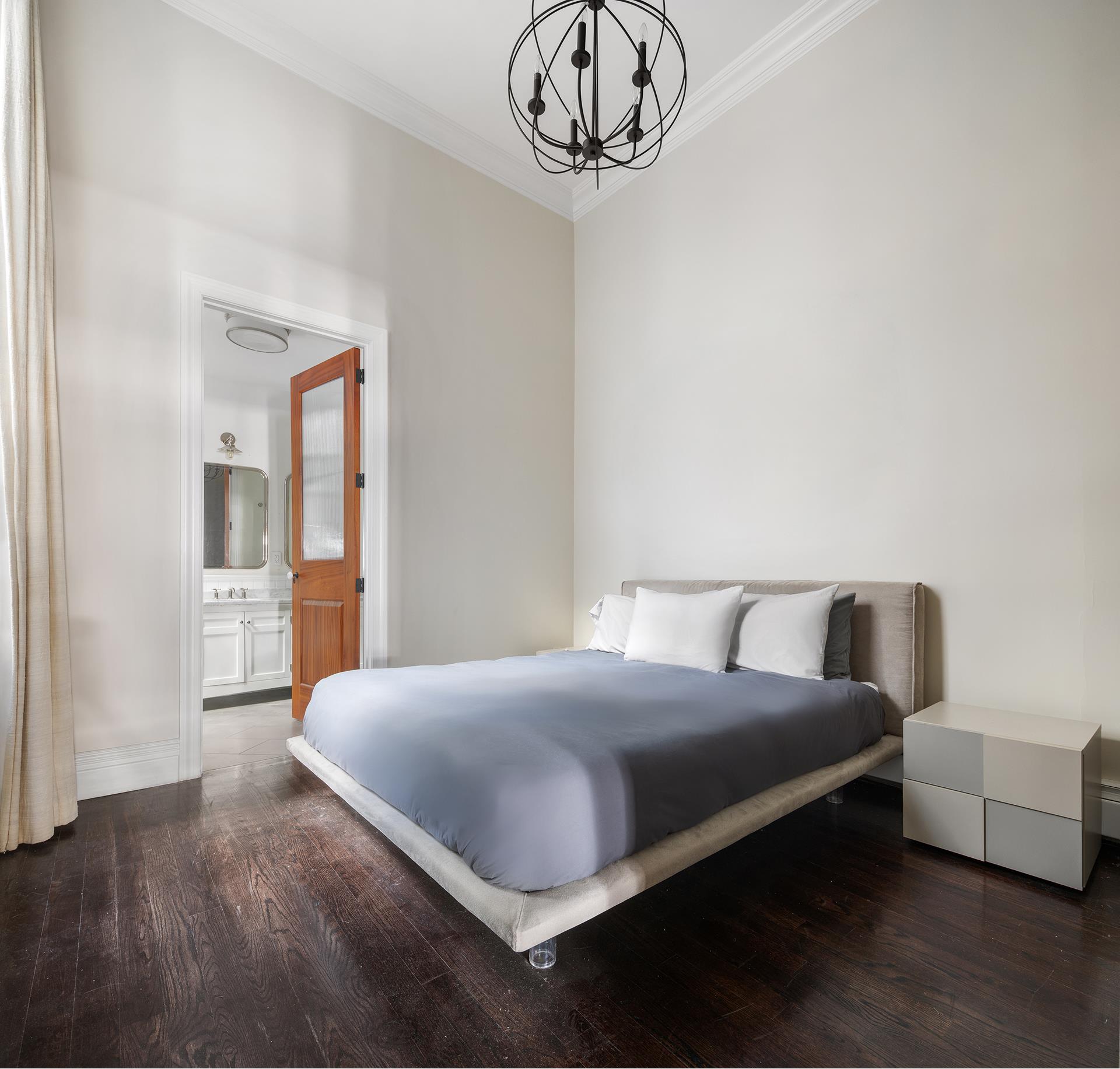 46 Mercer Street, Unit 4W Manhattan, NY 10013 - Photo 13 of 19 a bedroom with a bed and window