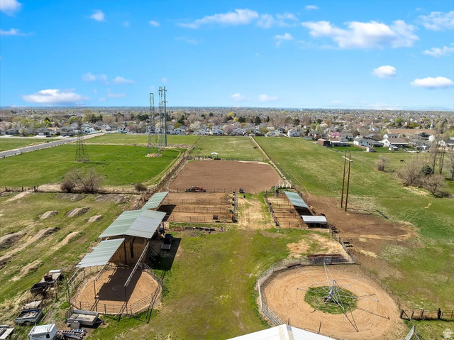 5321 South 3100th Street West Roy, UT 84067 - Photo 17 of 64 Expansive equestrian property featuring multiple fenced paddocks, covered stalls, and circular training pens