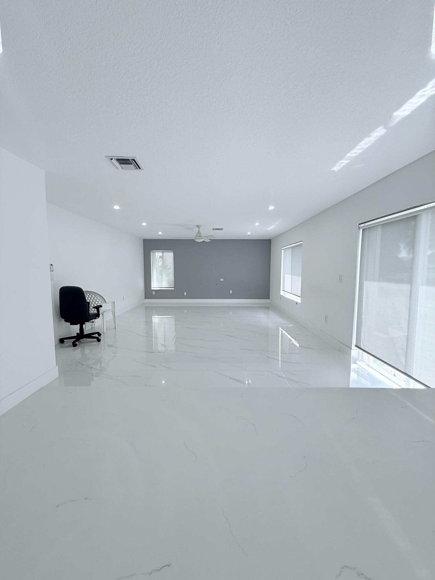 4534 Southwest 127th Terrace Miramar, FL 33027 - Photo 12 of 45 a view of empty room with wooden floor