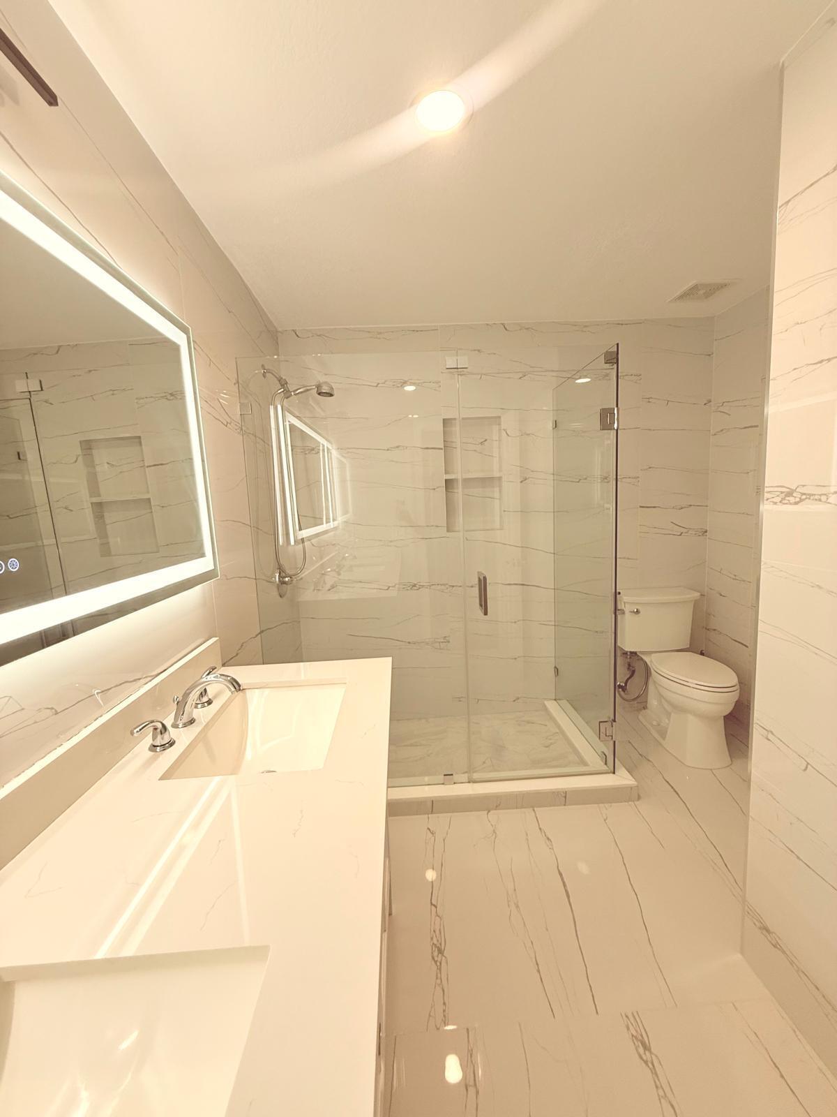 4534 Southwest 127th Terrace Miramar, FL 33027 - Photo 22 of 45 a bathroom with a bathtub and a shower