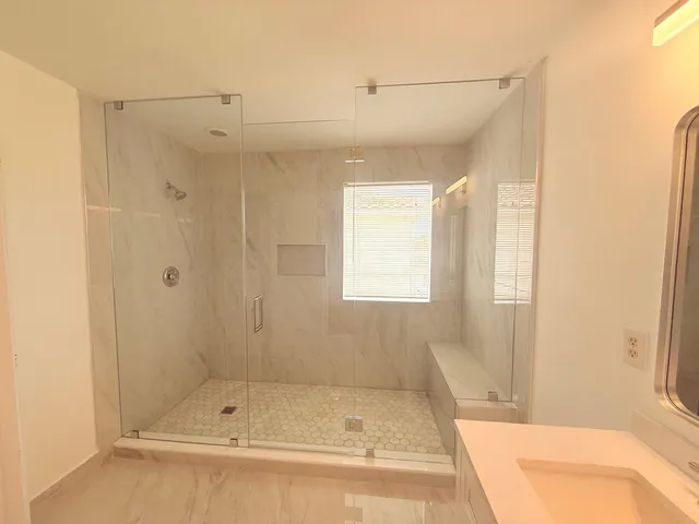 a bathroom with a shower and bathtub