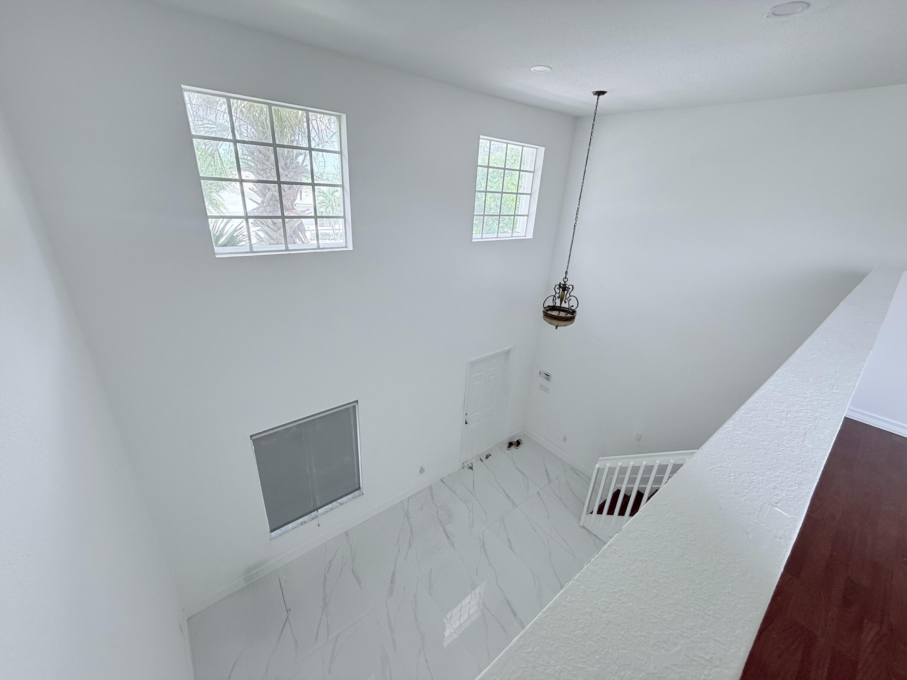 4534 Southwest 127th Terrace Miramar, FL 33027 - Photo 28 of 45 a bedroom with windows