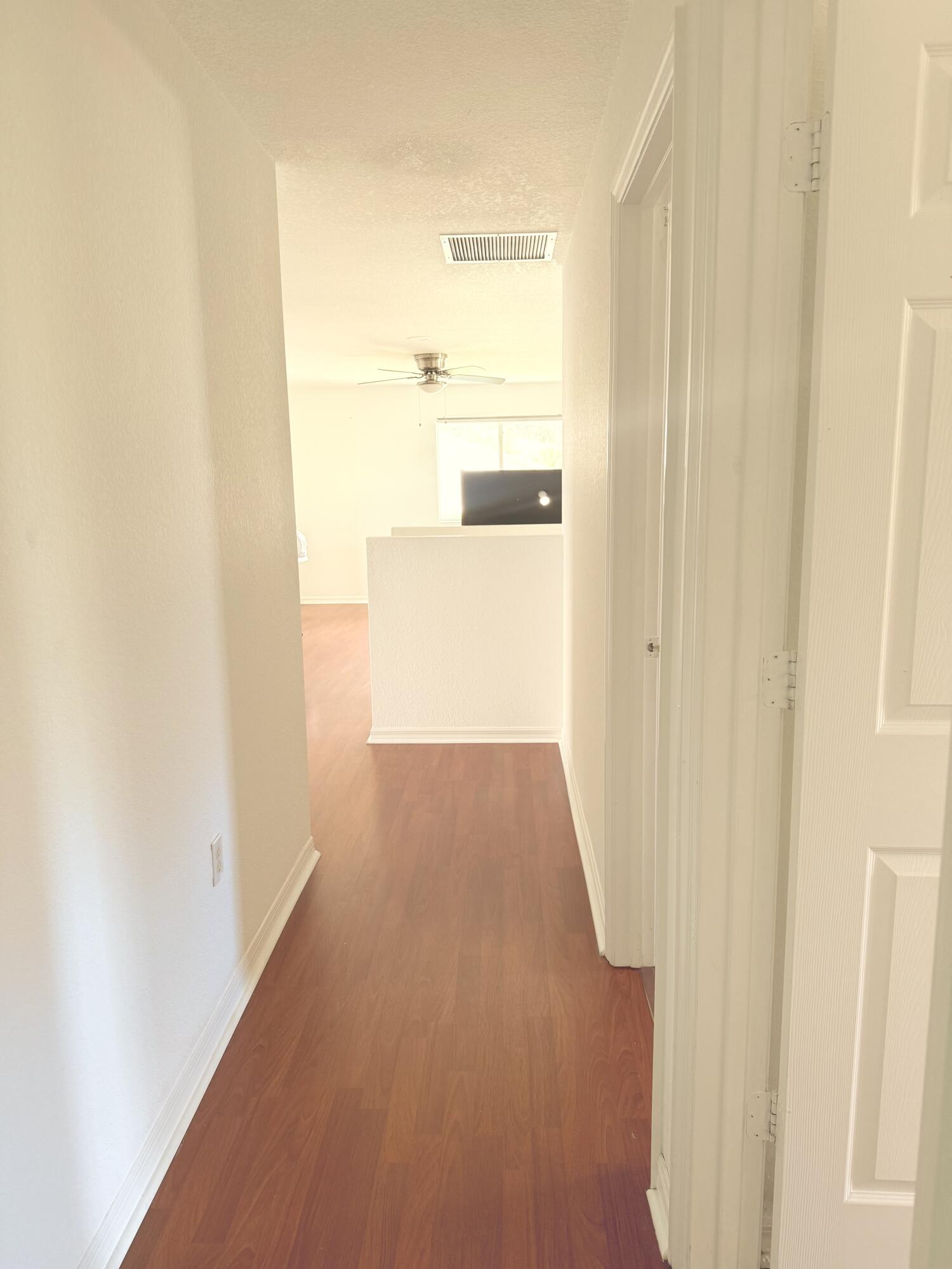 4534 Southwest 127th Terrace Miramar, FL 33027 - Photo 30 of 45 a view of a hallway with wooden floor