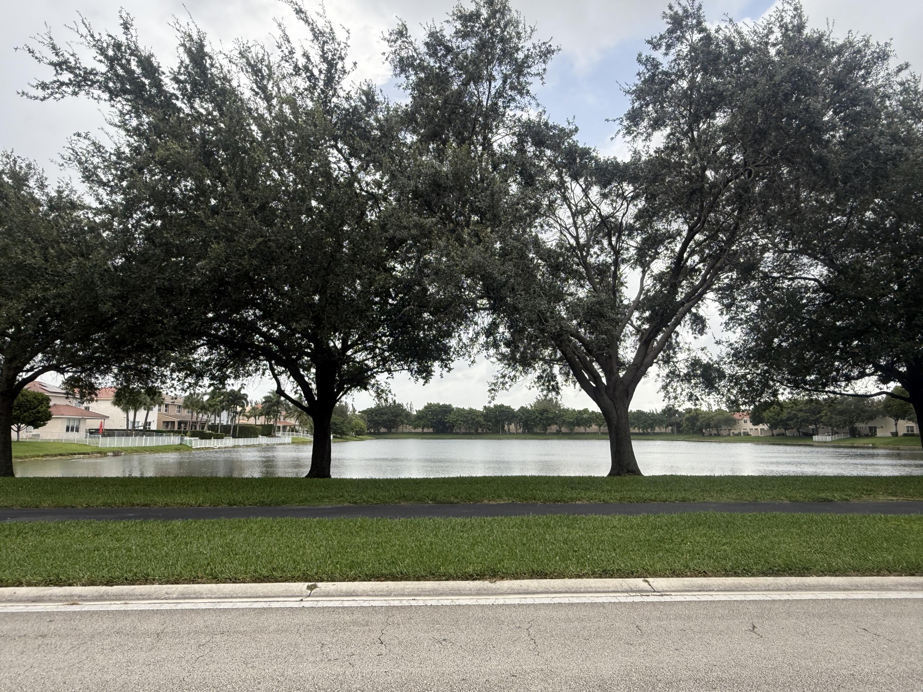 4534 Southwest 127th Terrace Miramar, FL 33027 - Photo 3 of 45 a view of green field with trees in the background