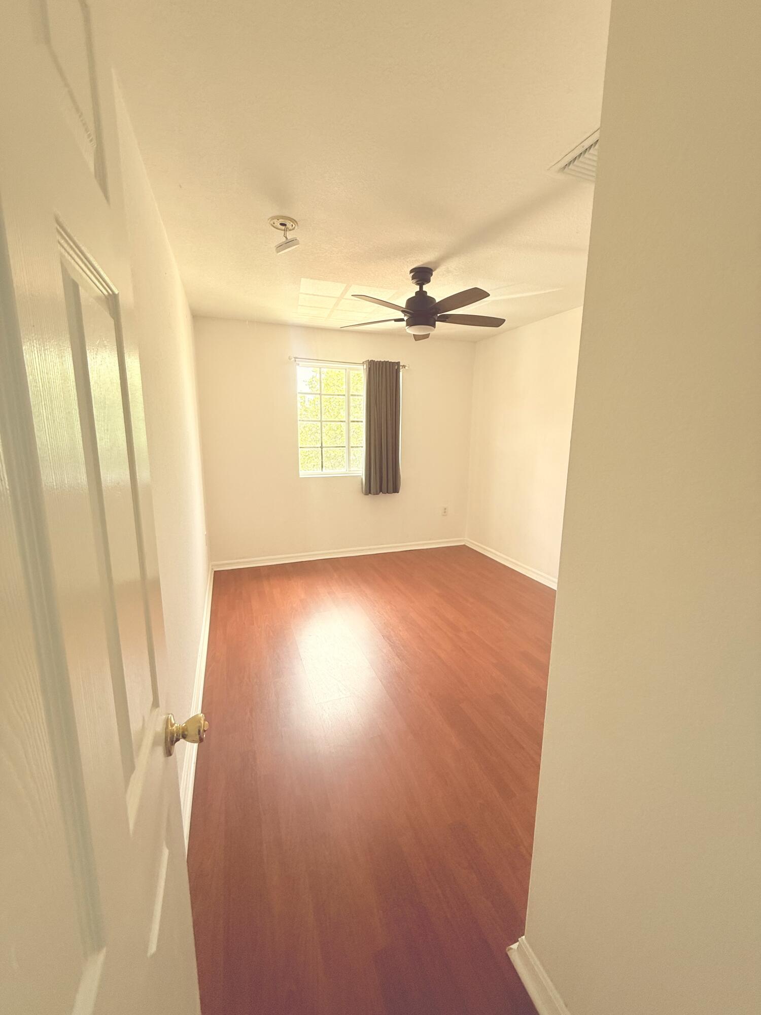 4534 Southwest 127th Terrace Miramar, FL 33027 - Photo 35 of 45 a view of a room with wooden floor and a window