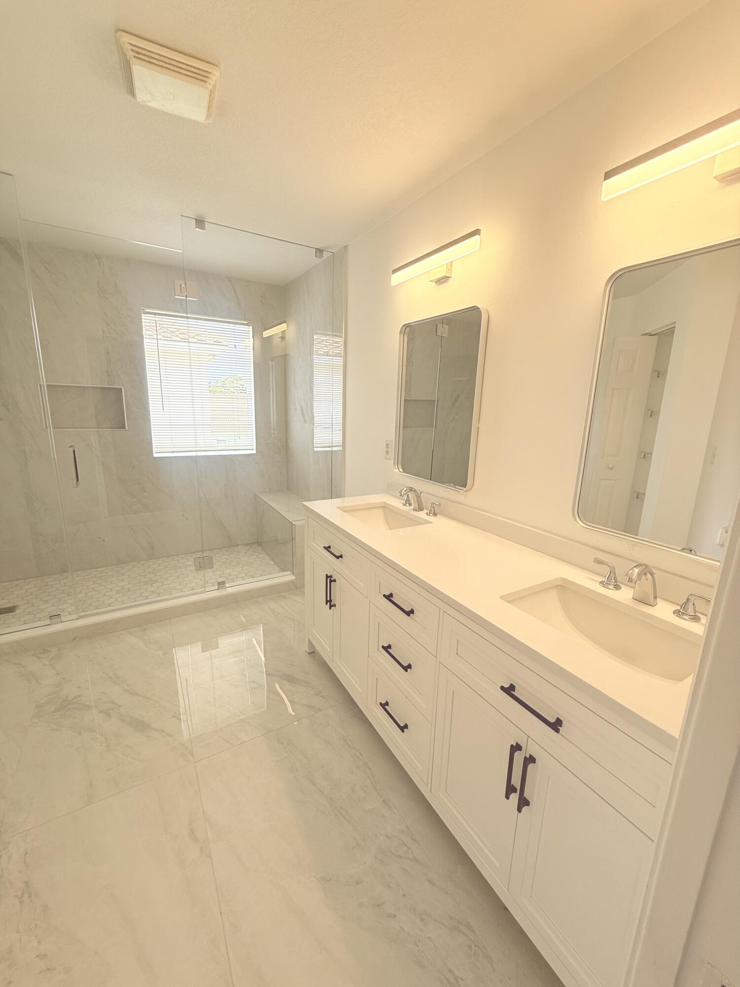 4534 Southwest 127th Terrace Miramar, FL 33027 - Photo 39 of 45 a spacious bathroom with sinks mirror and a bathtub