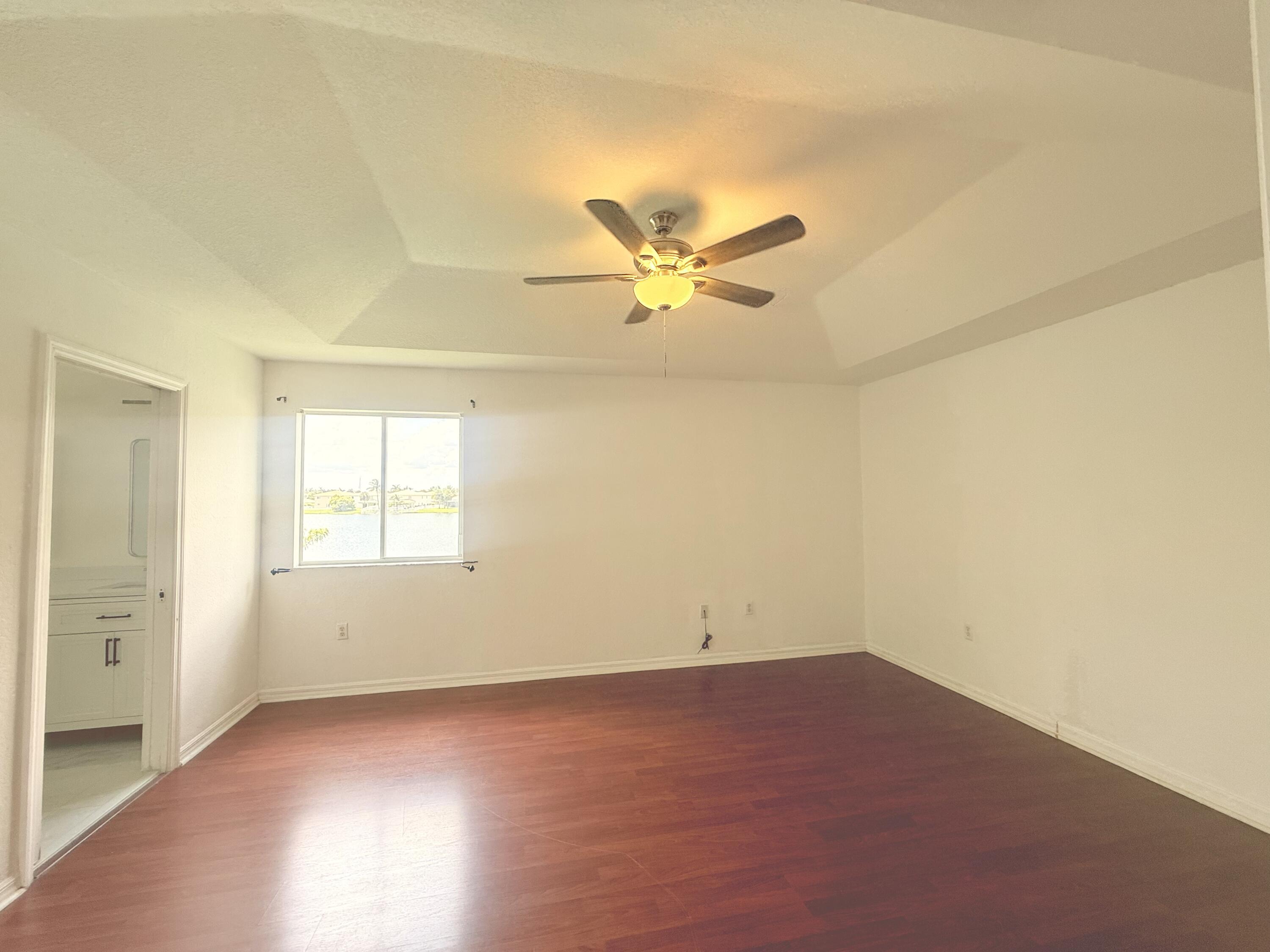 4534 Southwest 127th Terrace Miramar, FL 33027 - Photo 43 of 45 an empty room with a ceiling fan and window