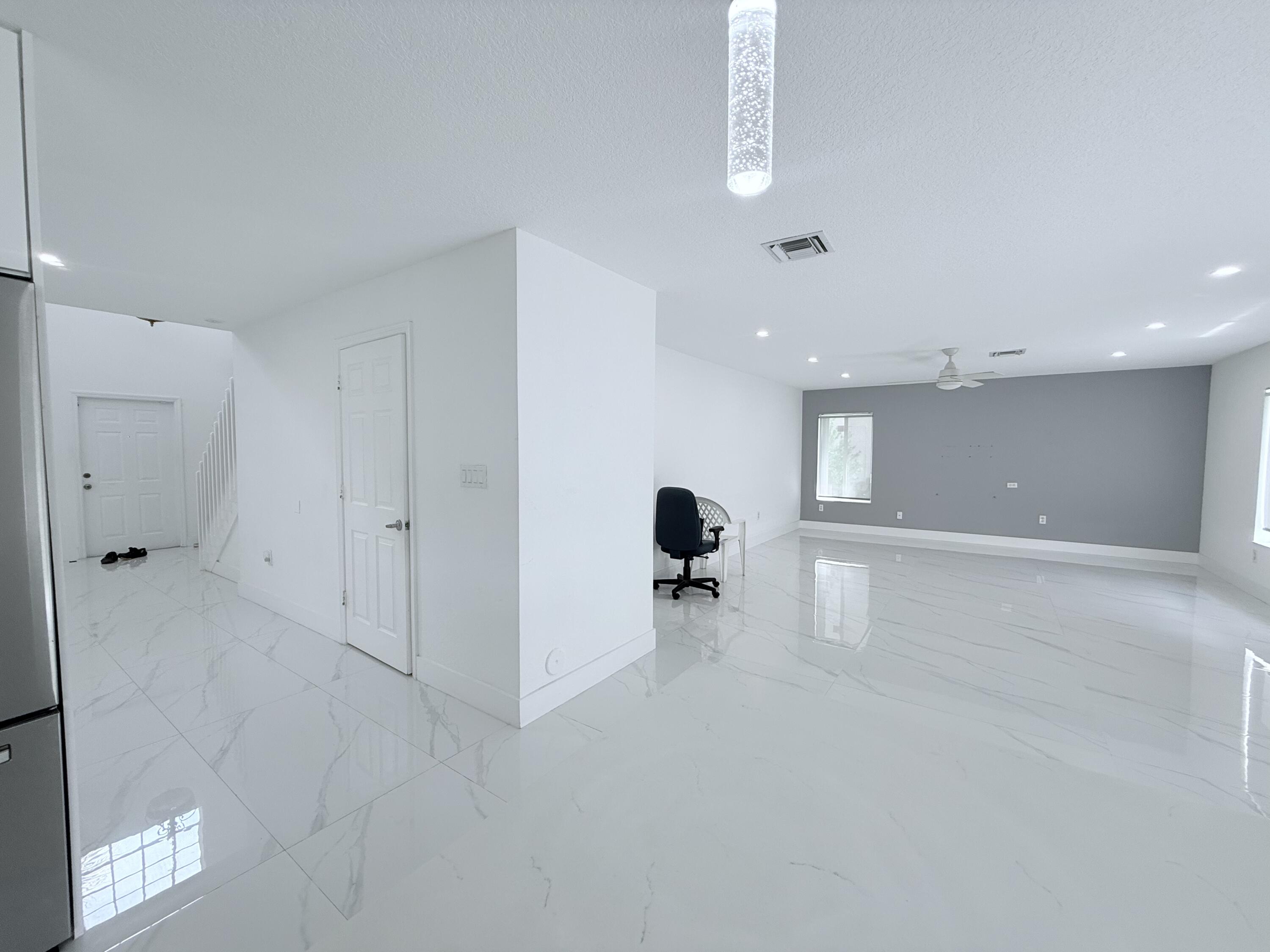 4534 Southwest 127th Terrace Miramar, FL 33027 - Photo 8 of 45 a view of a livingroom with a staircase