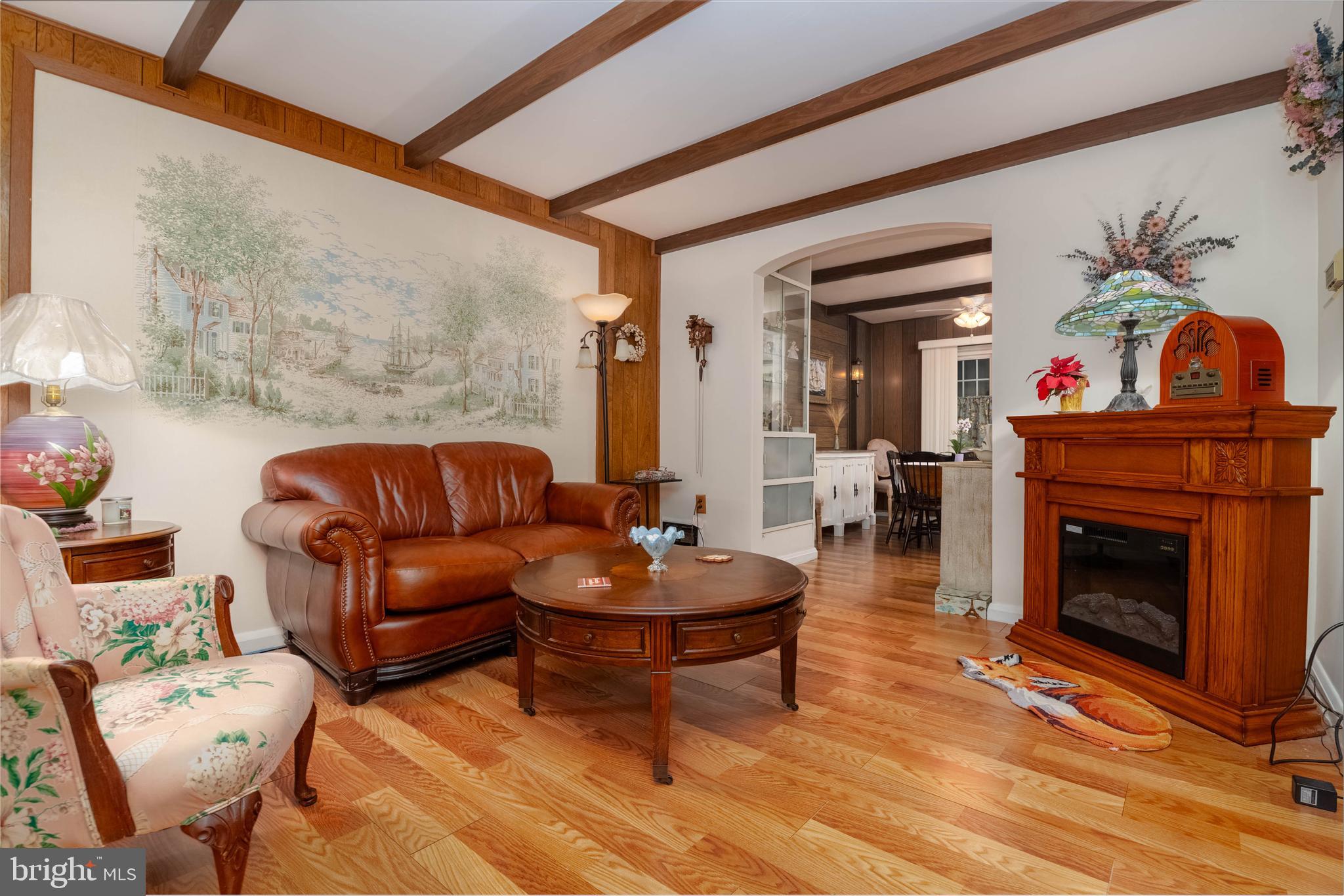 1930 Stanhope Road Baltimore, MD 21222 - Photo 3 of 32 a living room with furniture a fireplace and a potted plant