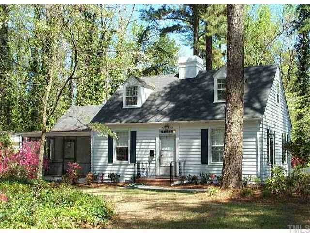 a view of a house with sitting area and garden