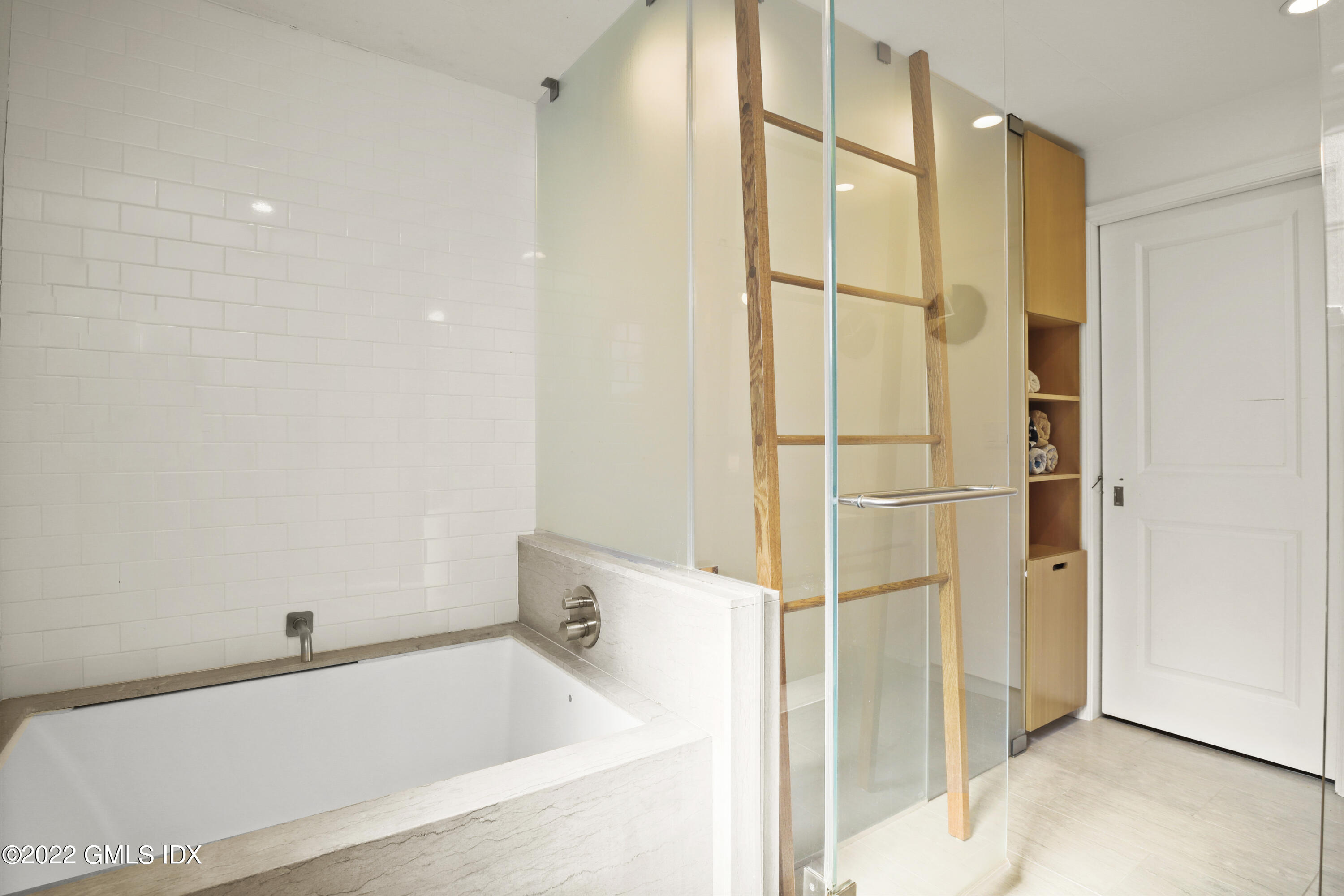 17 Tory Road Riverside, CT 06878 - Photo 11 of 19 a bathroom with a bathtub and a shower