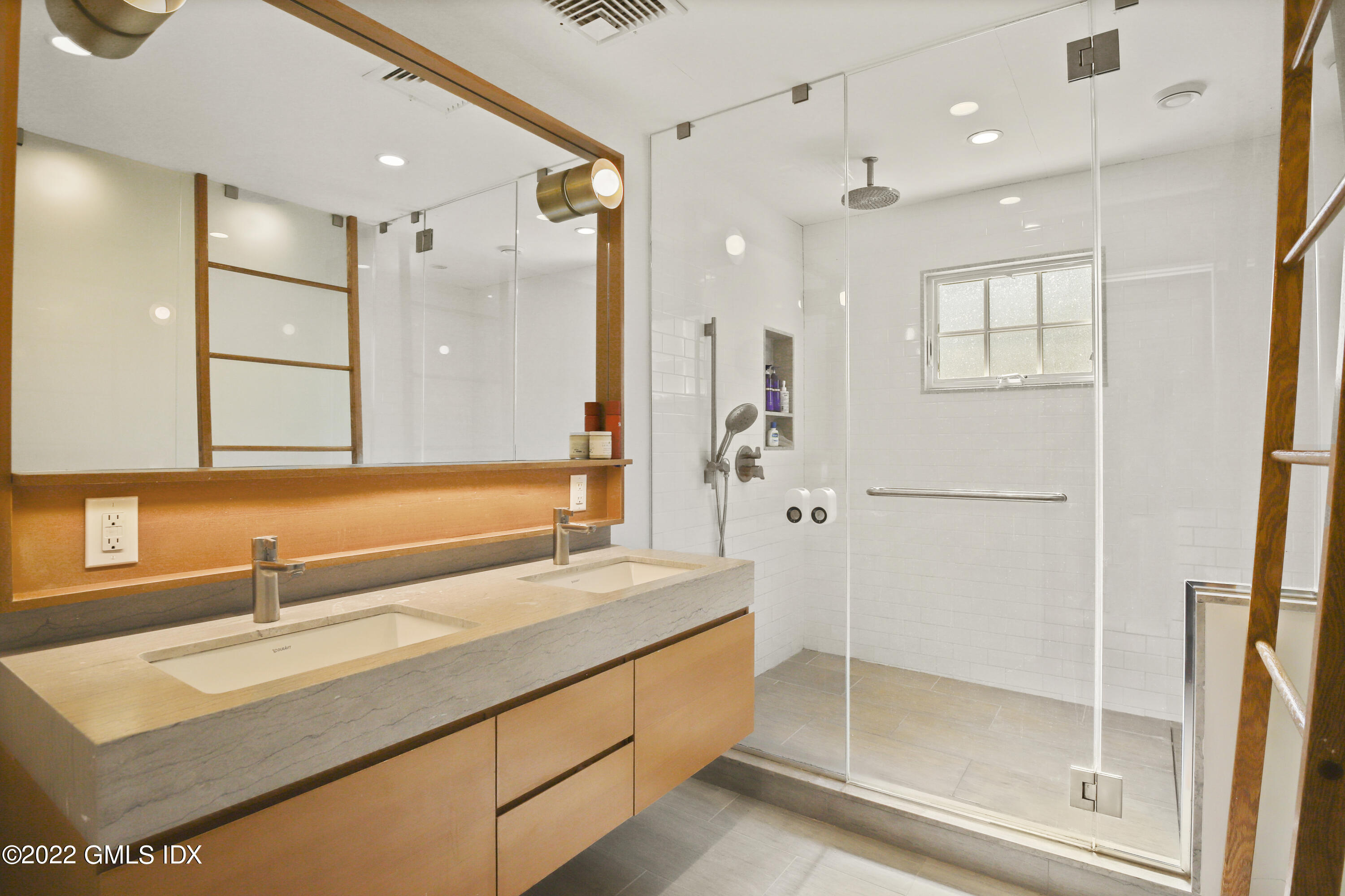 17 Tory Road Riverside, CT 06878 - Photo 10 of 19 a bathroom with a double vanity sink mirror and shower