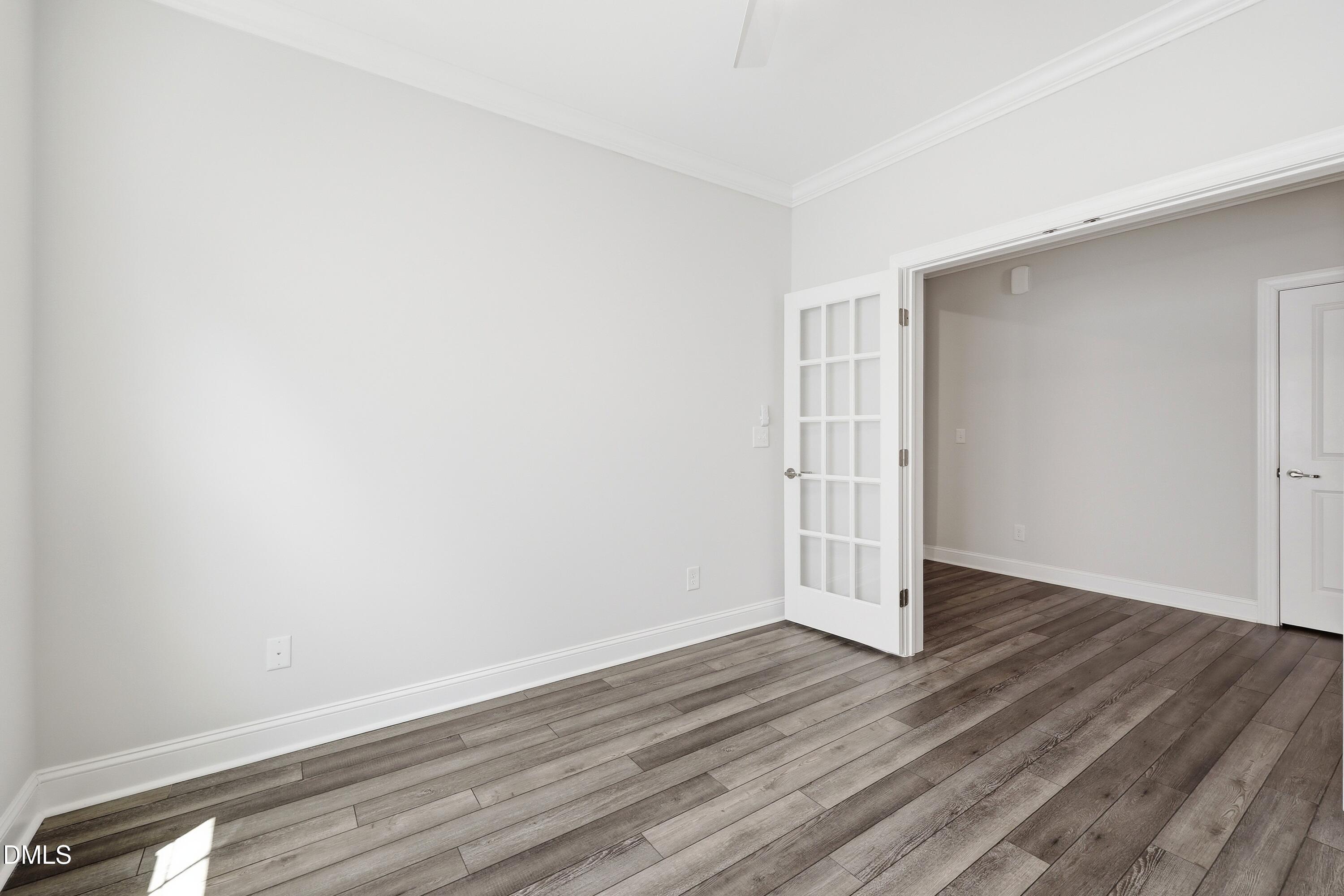 289 English Violet Lane Raleigh, NC 27610 - Photo 9 of 40 an empty room with wooden floor
