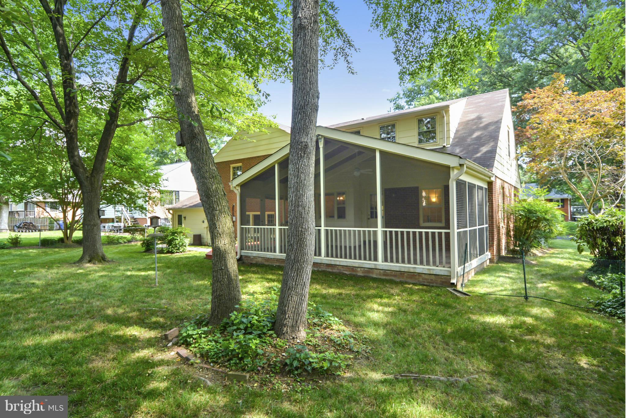 1705 Old Stage Road Alexandria, VA 22308 - Photo 18 of 23 a view of a house with a yard and a tree