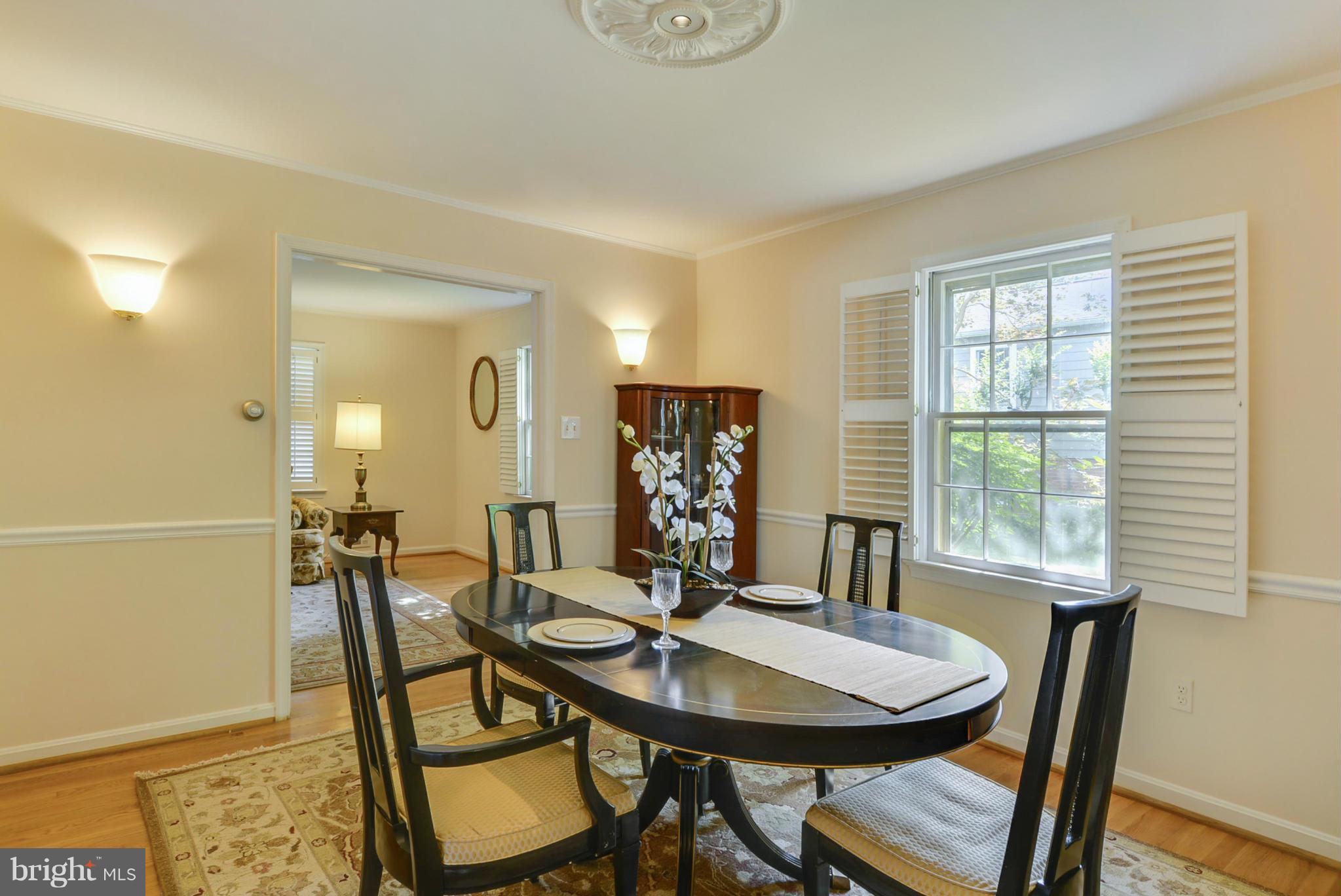 1705 Old Stage Road Alexandria, VA 22308 - Photo 4 of 23 a view of a dining room with furniture and window
