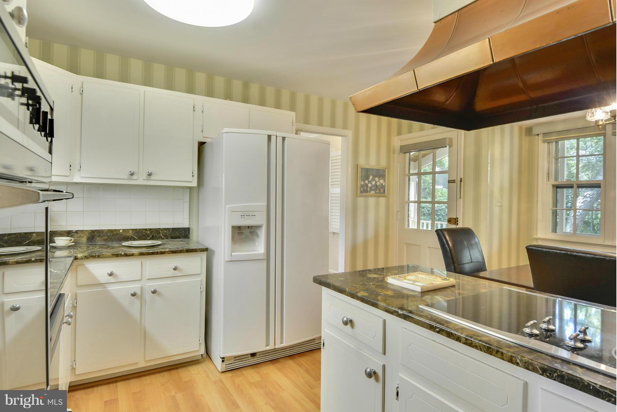 1705 Old Stage Road Alexandria, VA 22308 - Photo 5 of 23 a kitchen with stainless steel appliances granite countertop a sink a stove and a refrigerator