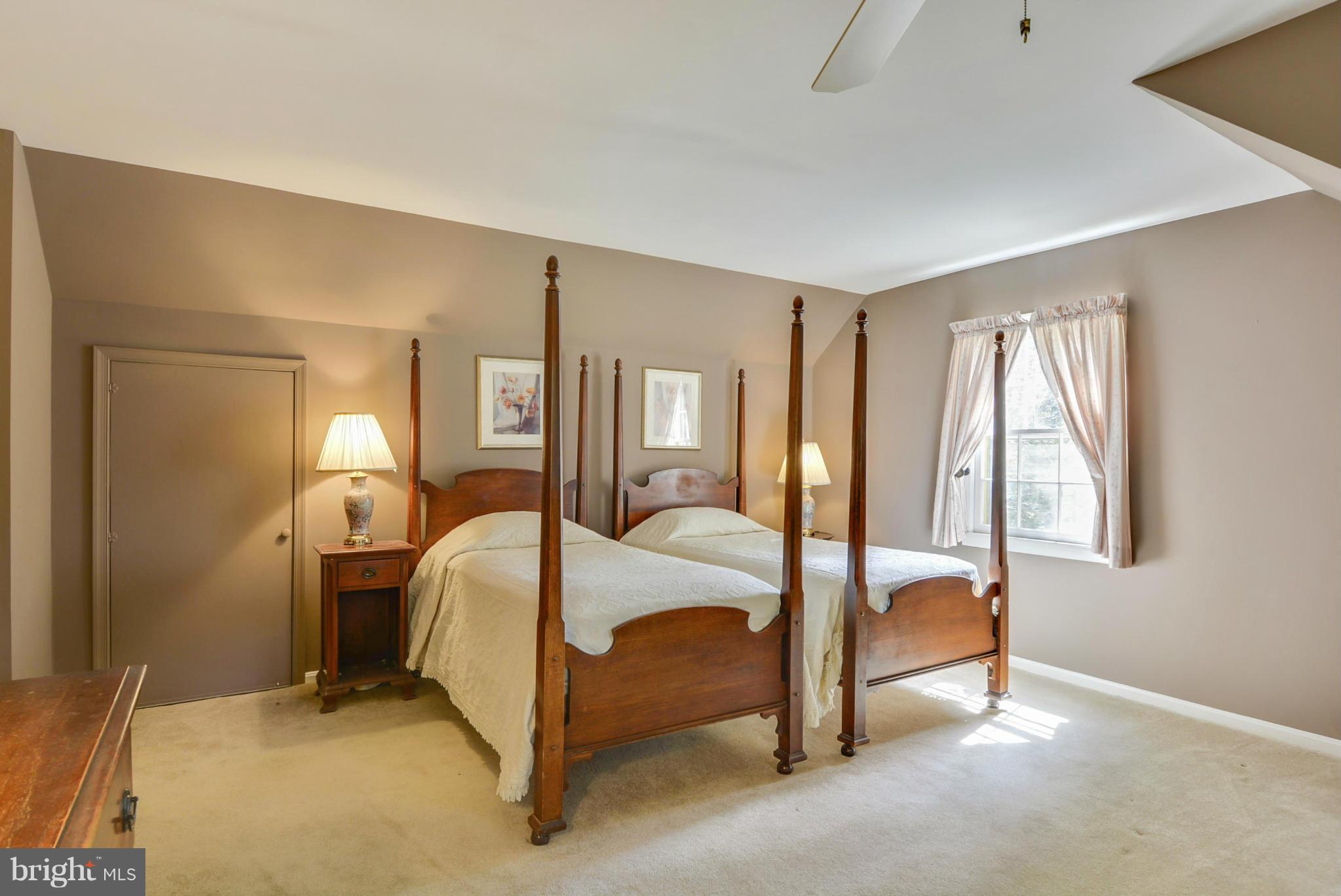 1705 Old Stage Road Alexandria, VA 22308 - Photo 8 of 23 a bed room with a bed and a lamp