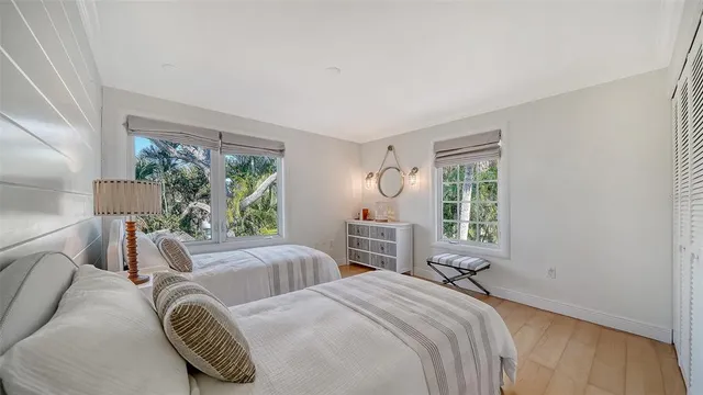 a balcony with outdoor seating and plants