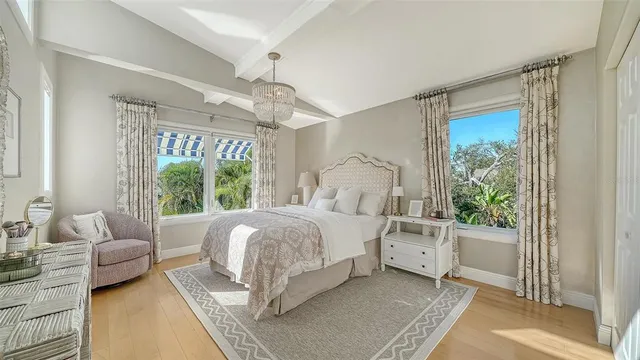 a view of a patio with a table and chairs under an umbrella