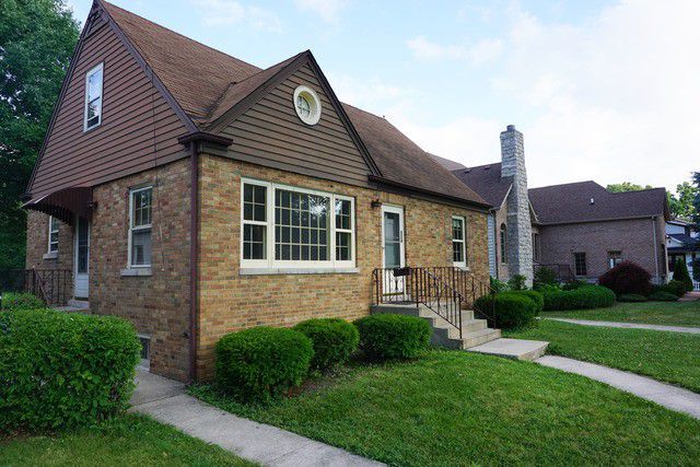 324 South Maple Street Itasca, IL 60143 - Photo 1 of 21 a front view of a house with garden