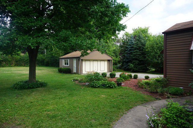 324 South Maple Street Itasca, IL 60143 - Photo 7 of 21 a front view of a house with garden