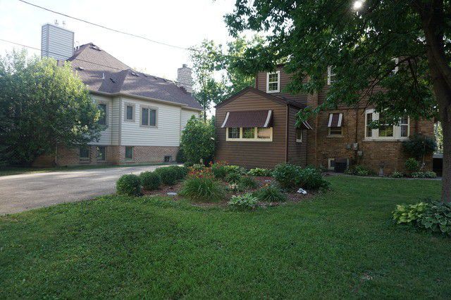 324 South Maple Street Itasca, IL 60143 - Photo 8 of 21 a front view of a house with a yard