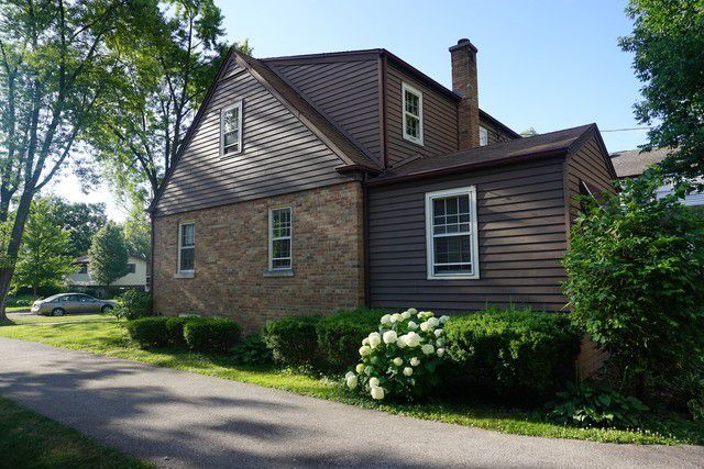 324 South Maple Street Itasca, IL 60143 - Photo 9 of 21 a front view of a house with a garden