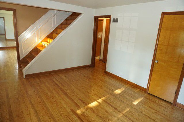 324 South Maple Street Itasca, IL 60143 - Photo 10 of 21 a view of an empty room with wooden floor