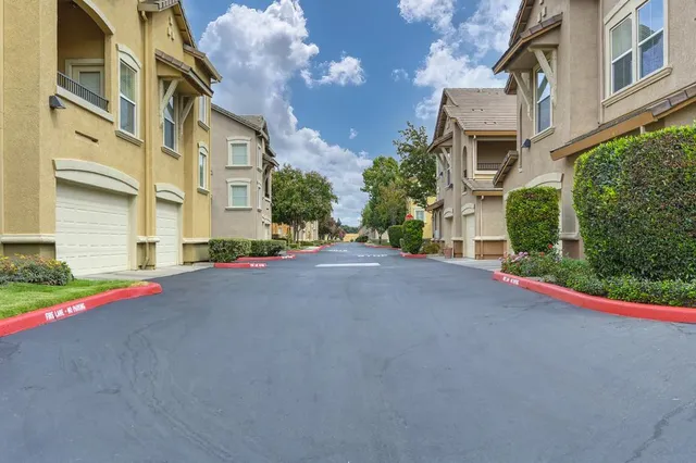 a view of a swimming pool with a lounge chairs