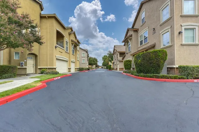 a view of a park with sitting area and garden