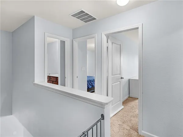 a view of a hallway with closet
