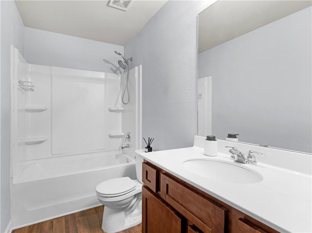 10891 Wheeler Trace Hampton, GA 30228 - Photo 38 of 45 a bathroom with a sink toilet and shower