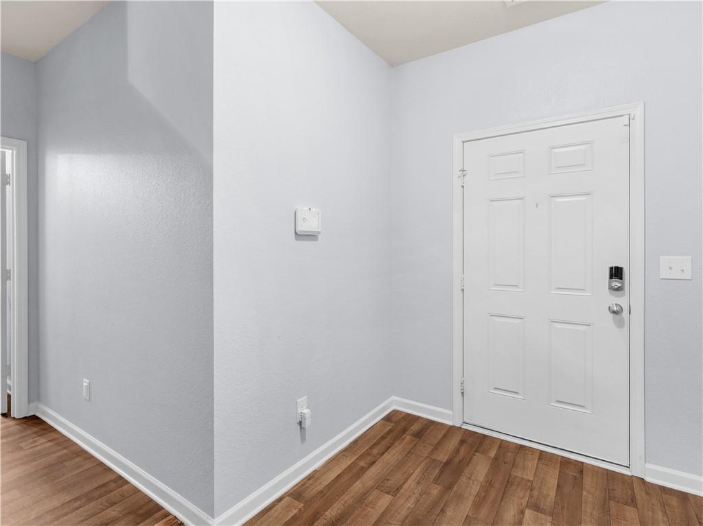 10891 Wheeler Trace Hampton, GA 30228 - Photo 6 of 45 wooden floor in an empty room