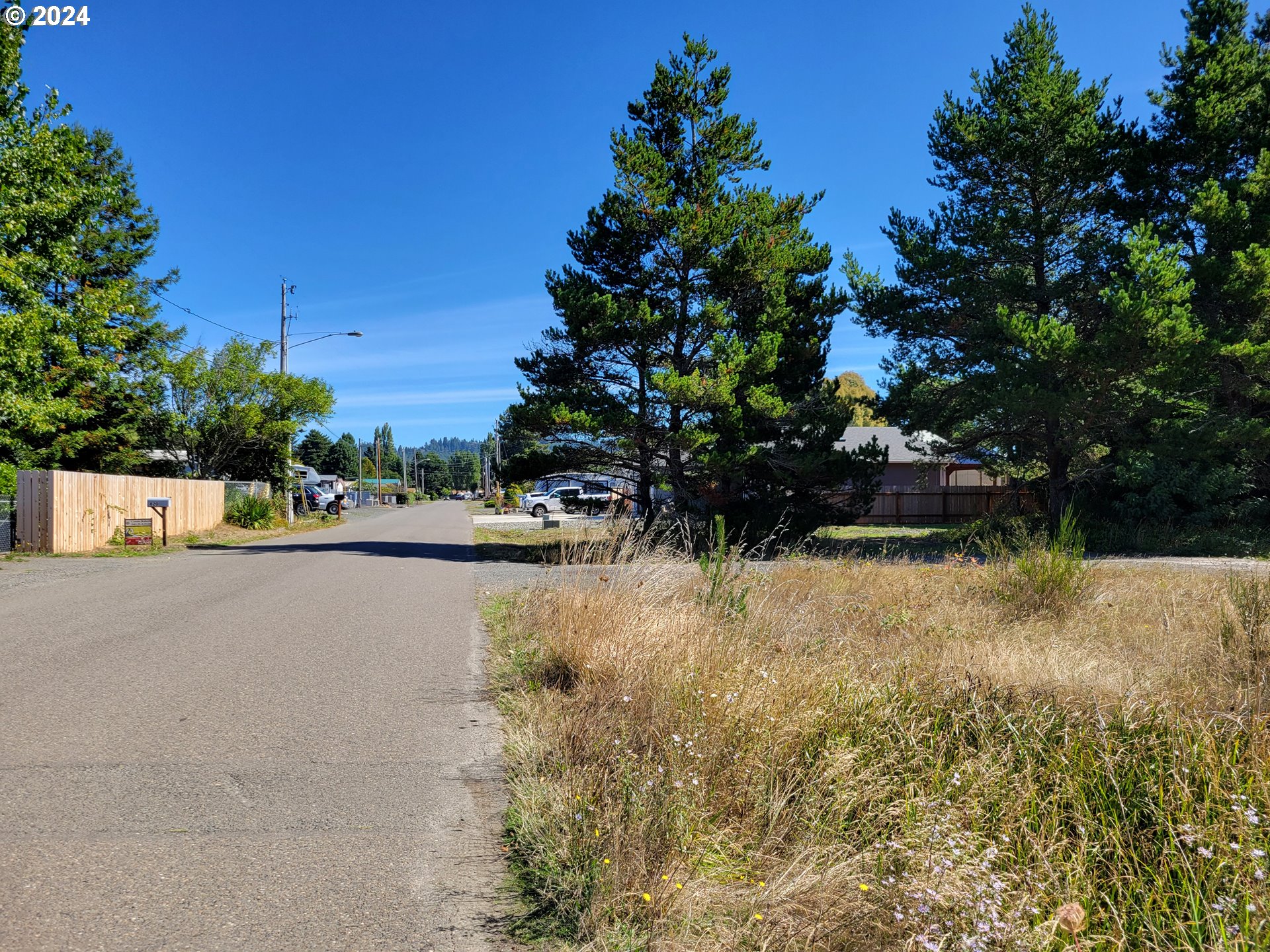 813 Jacobson Way Lakeside, OR 97449 - Photo 3 of 5 a view of swimming pool and lake view